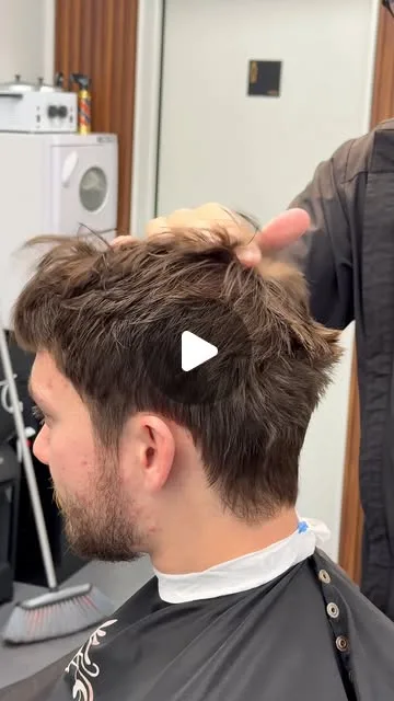 Barber styling a client’s short haircut in the Bliss & Blade Instagram Reel