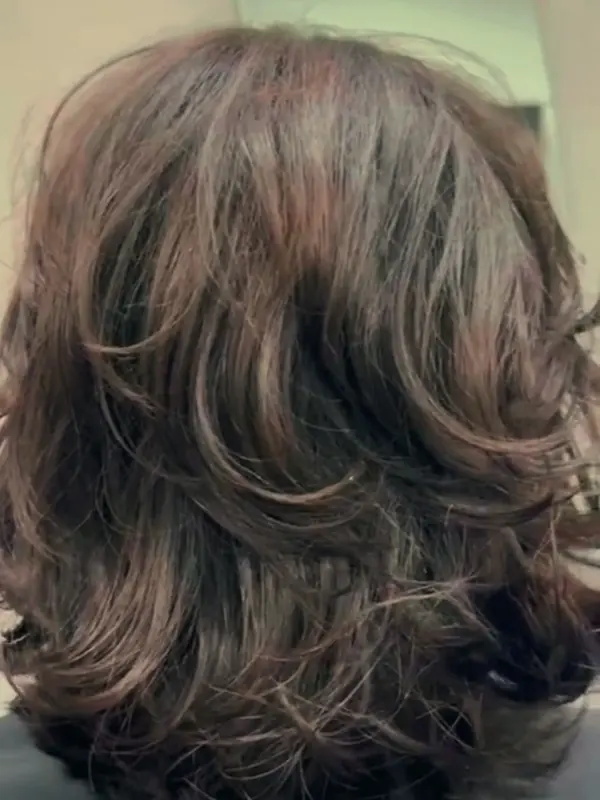 Long, curled hair styled at the salon