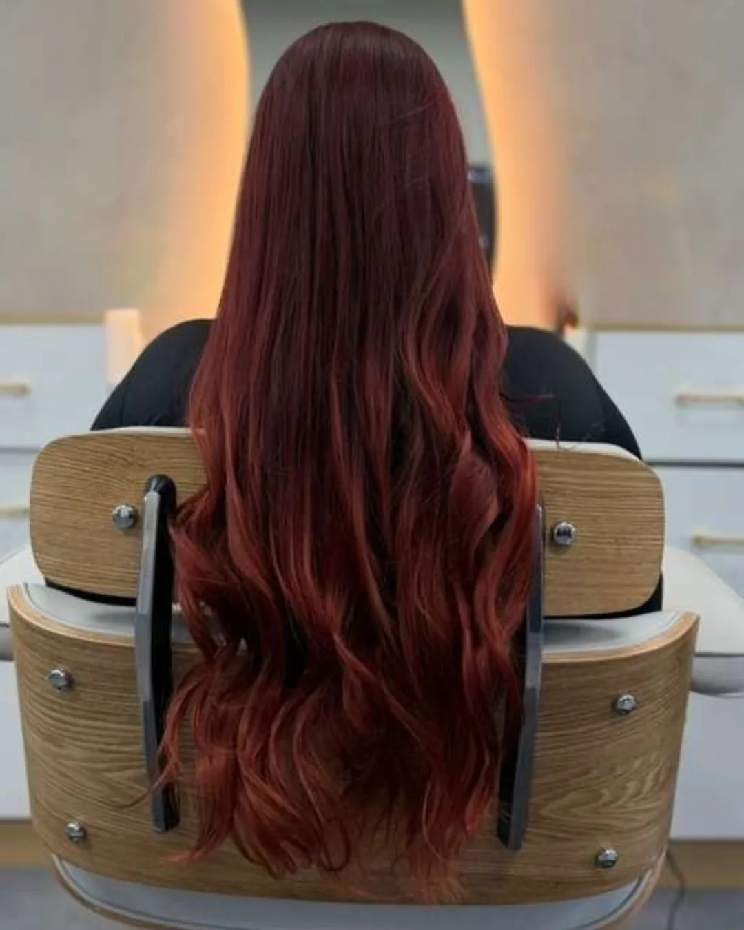 Long red hair viewed from behind at Bliss & Blade