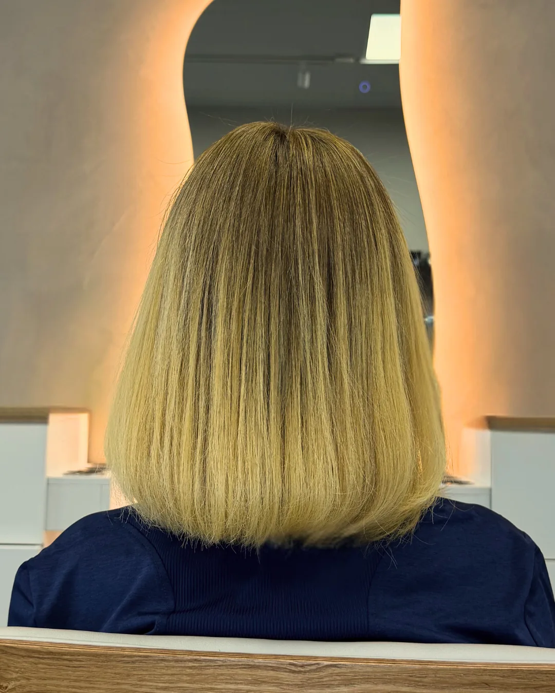 Blonde bob with a straight finish at Bliss & Blade