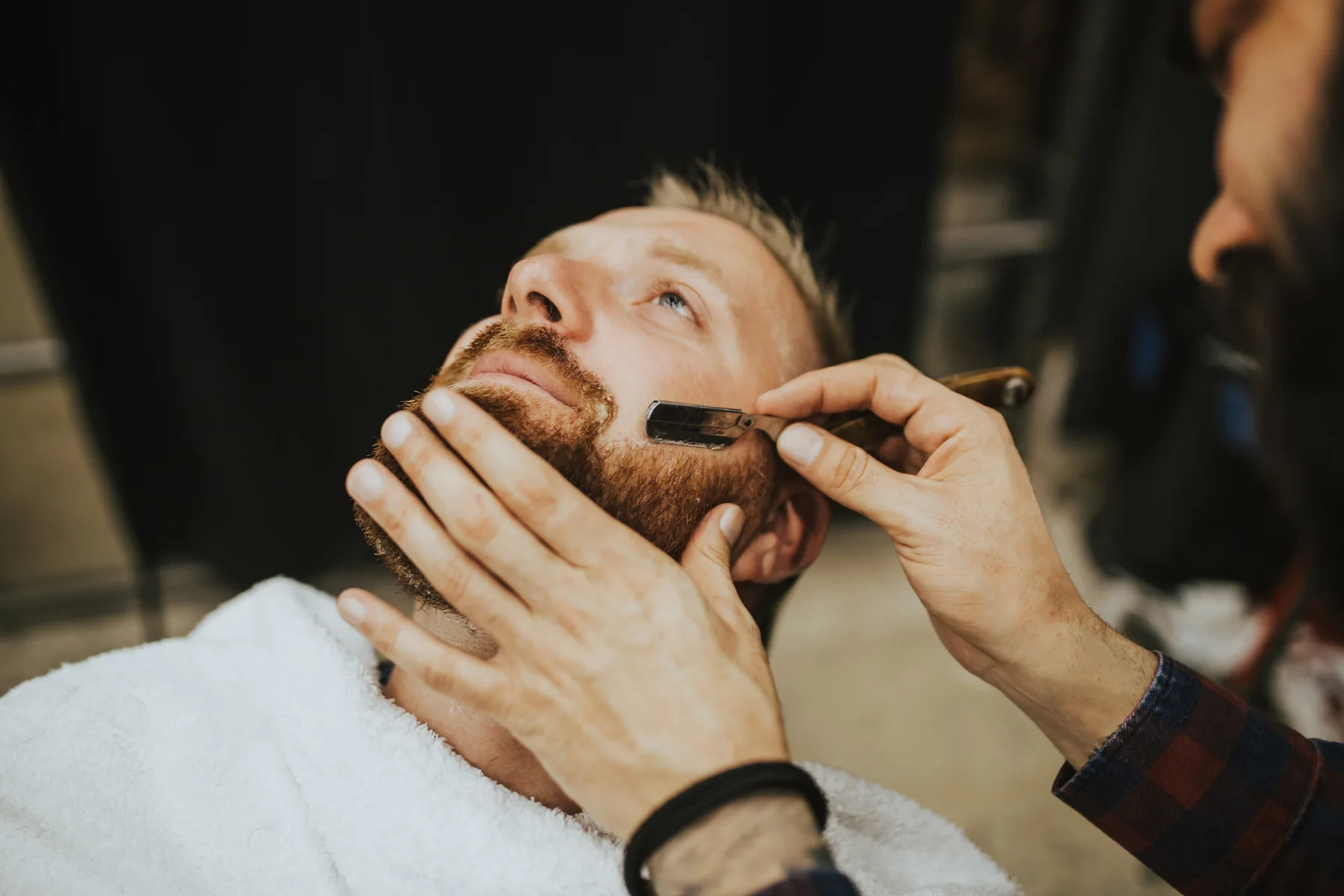 Barber at work at Bliss & Blade in Foster City