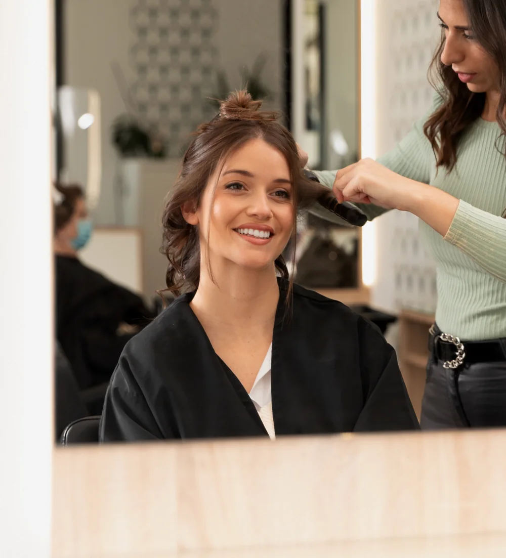 Client receiving a hair treatment at Bliss & Blade in Foster City